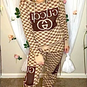 Women’s Size Small Designer Track Suit
Pullover Hoody and Track Pants